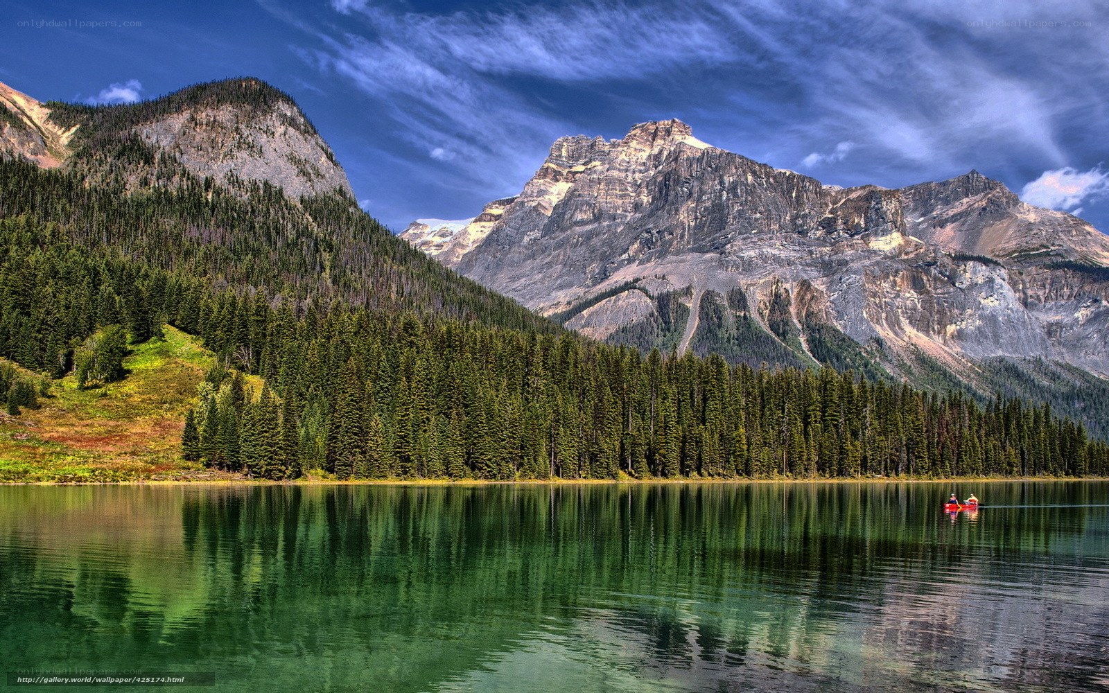 Mountain lake with canoe