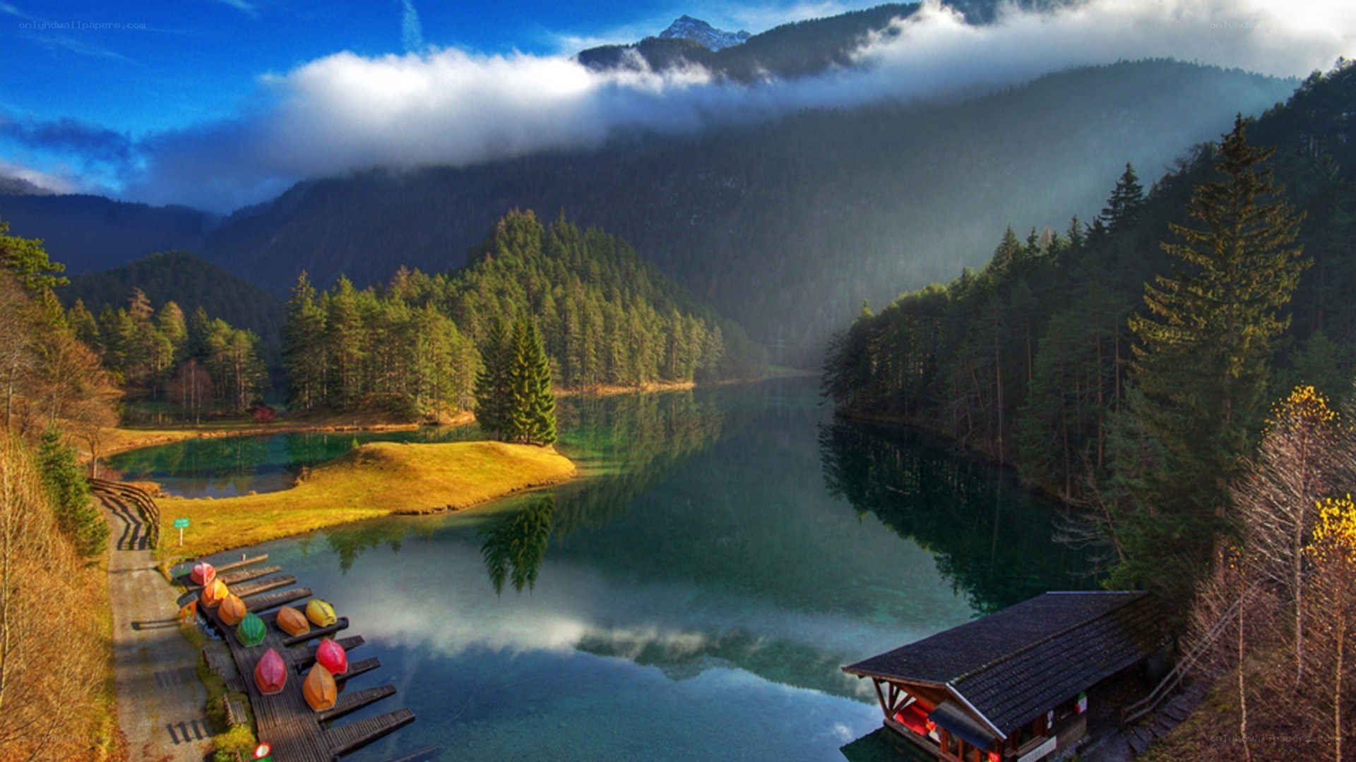 Mountain lake with canoes