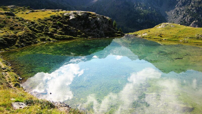 Mountain lake with clear reflection