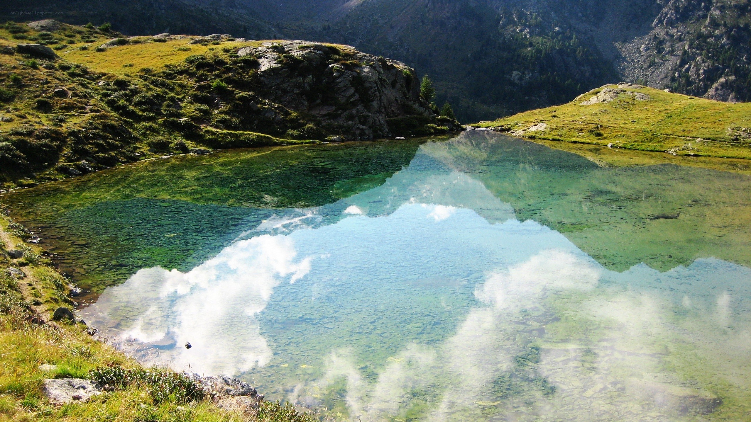 Mountain lake with clear reflection