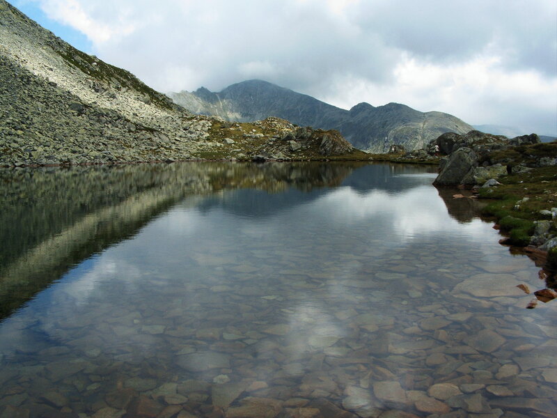 Mountain lake with clear reflection