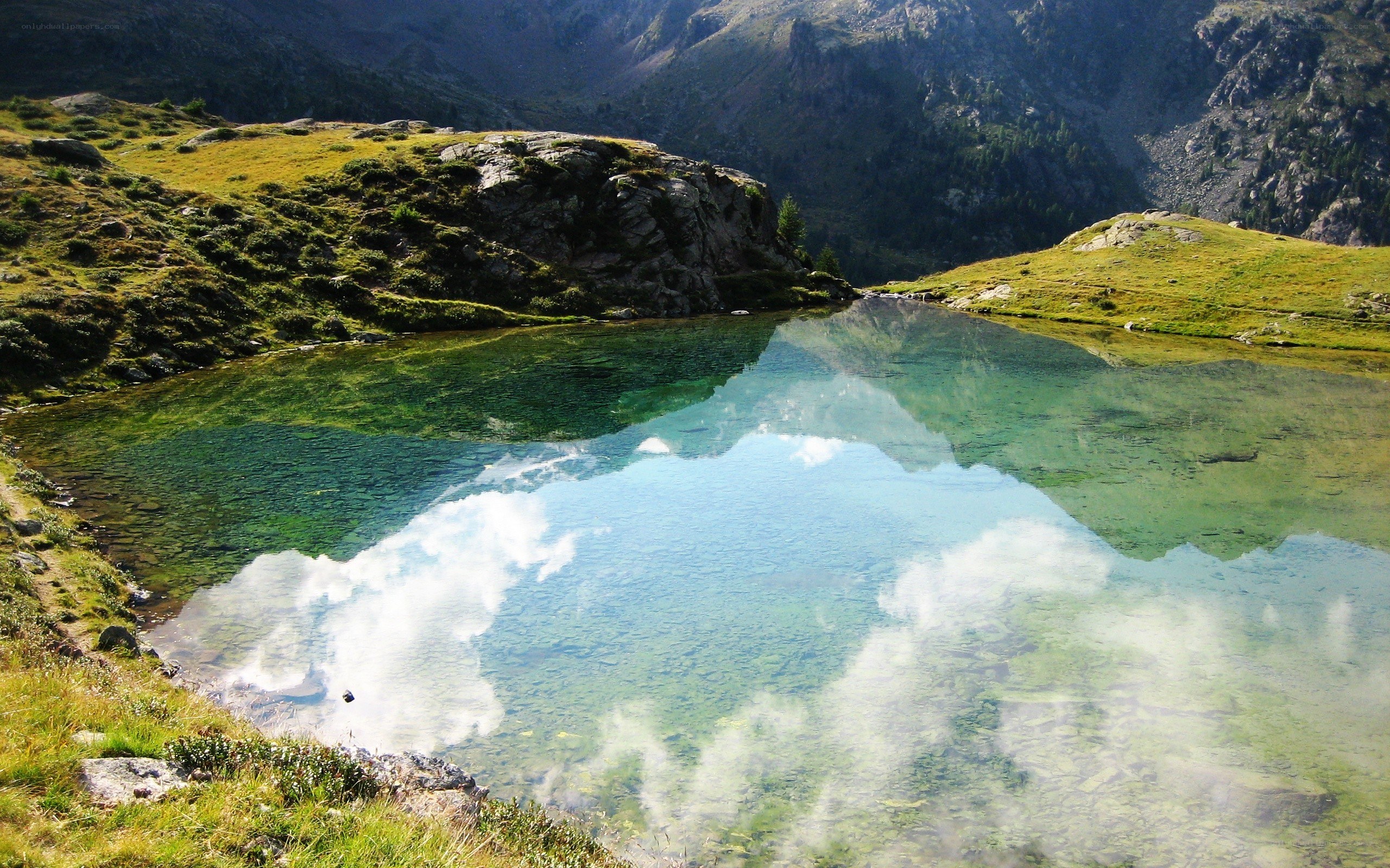 Mountain lake with clear reflection