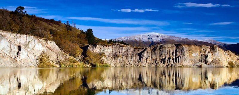 Mountain lake with cliff reflection