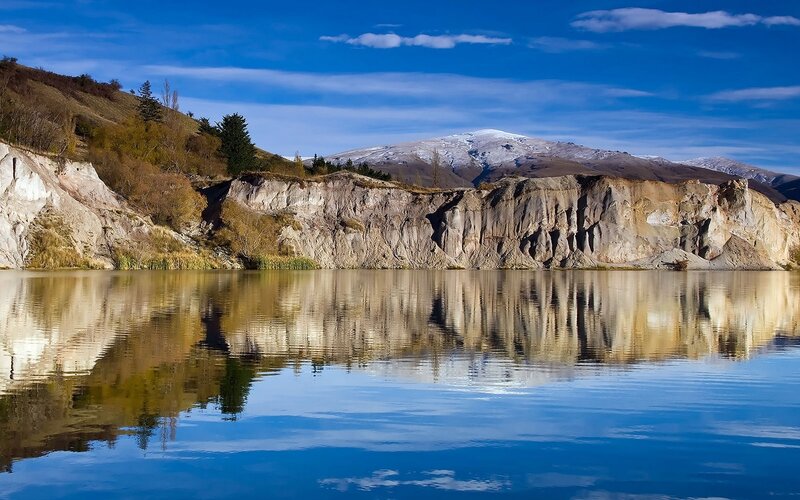 Mountain lake with cliff reflection