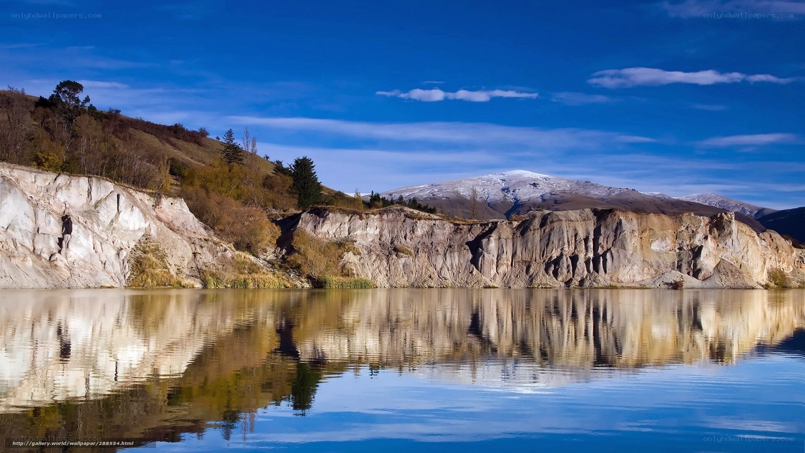 Mountain lake with cliff reflection