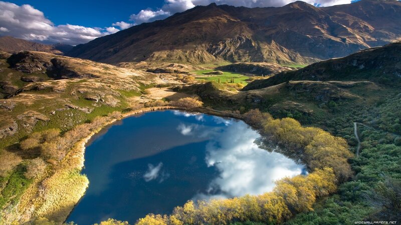Mountain lake with cloud reflection