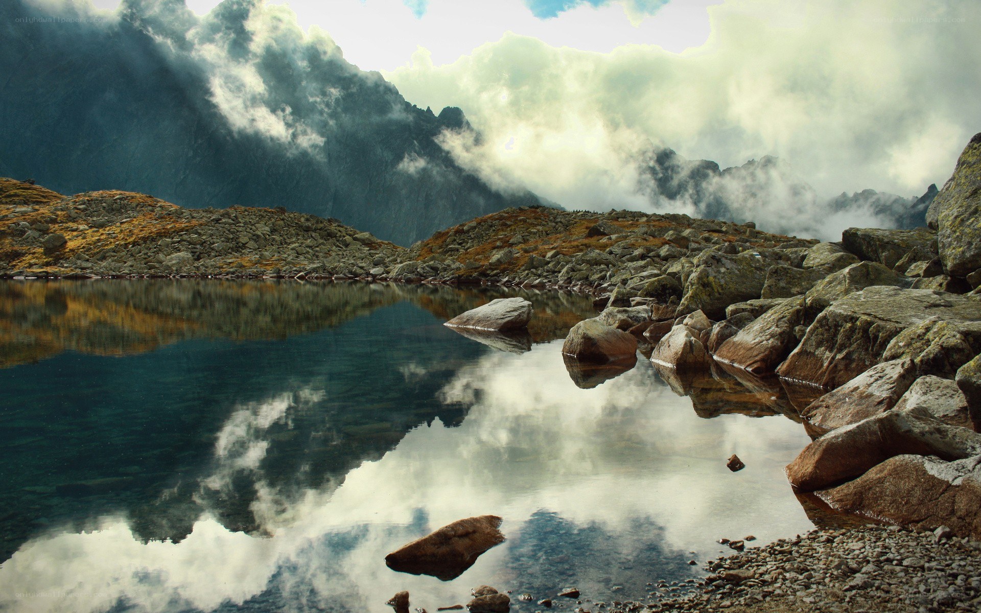 Mountain lake with cloud reflection