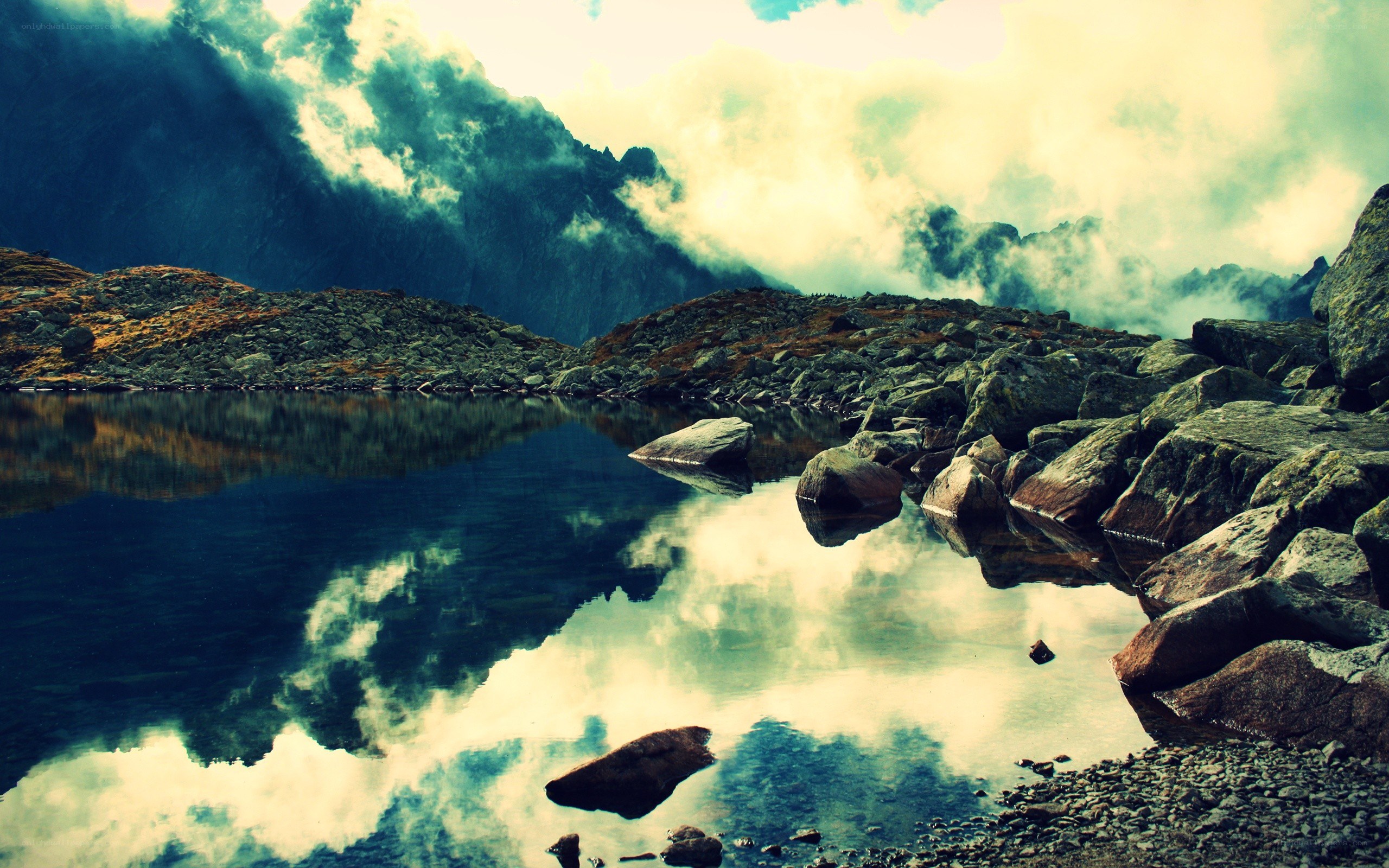 Mountain lake with cloud reflection