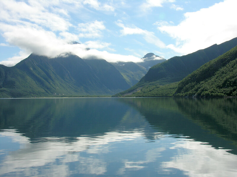 Mountain lake with cloud reflections