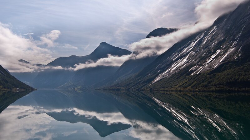 Mountain lake with cloud reflections