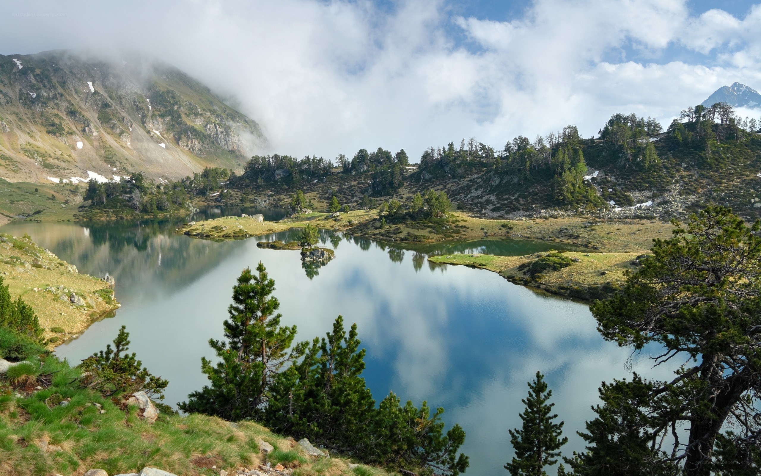 Mountain lake with cloud reflections
