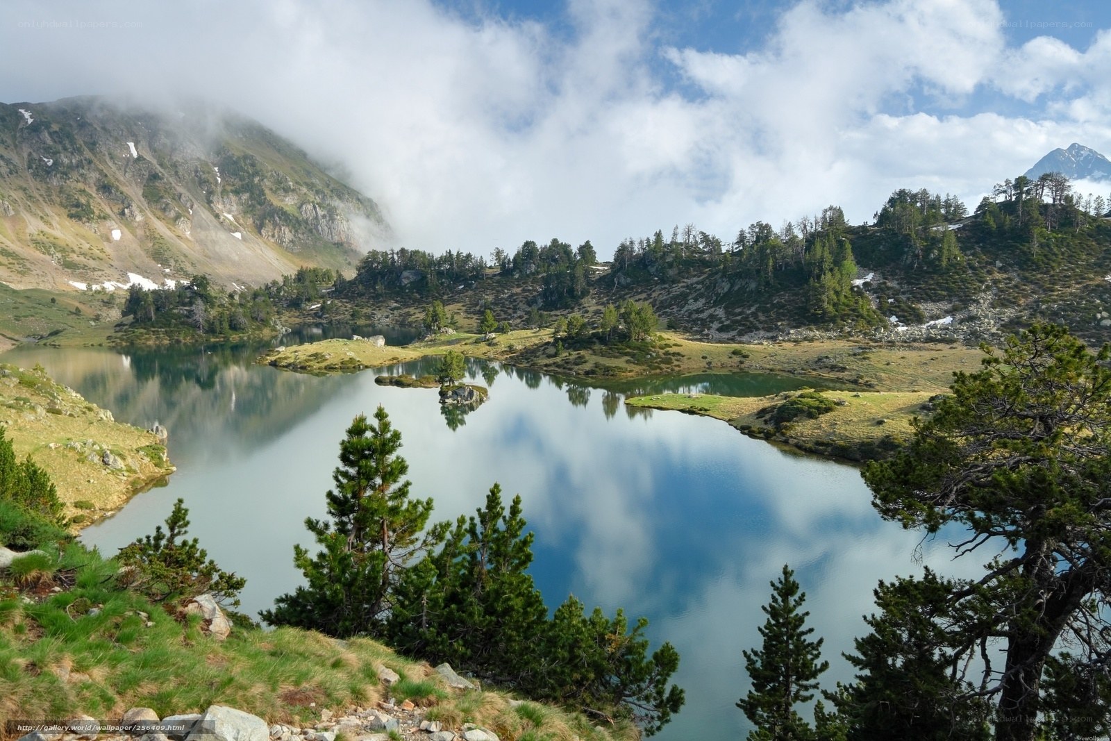 Mountain lake with cloud reflections