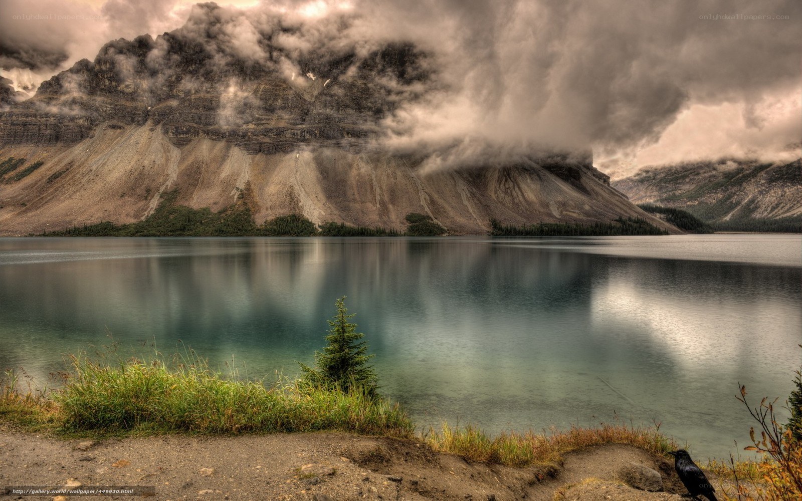 Mountain lake with cloudy sky