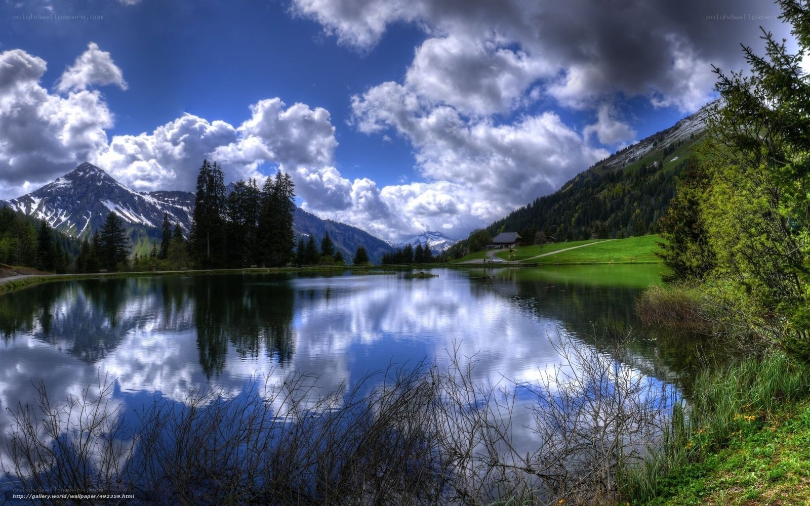 Mountain lake with cloudy sky