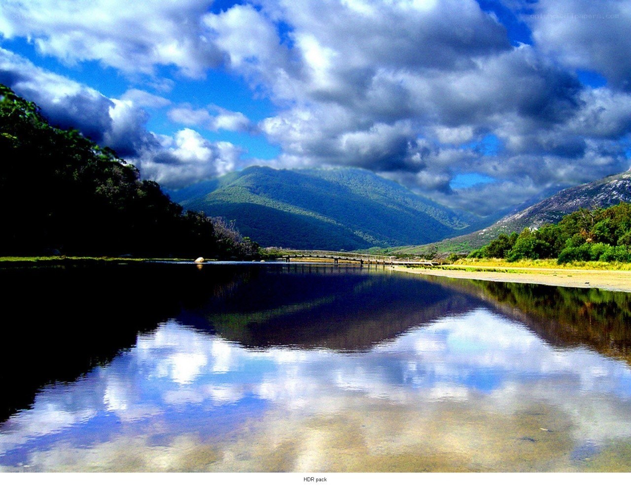 Mountain lake with cloudy sky
