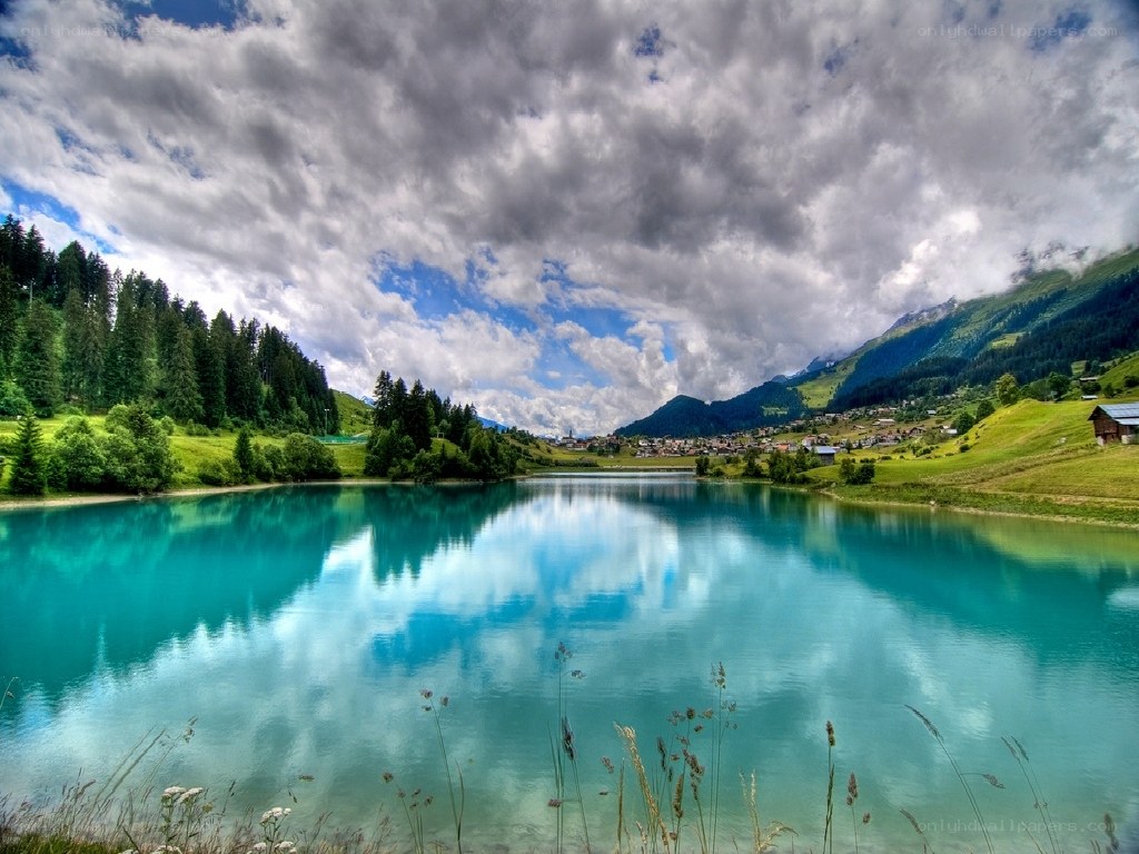 Mountain lake with cloudy sky
