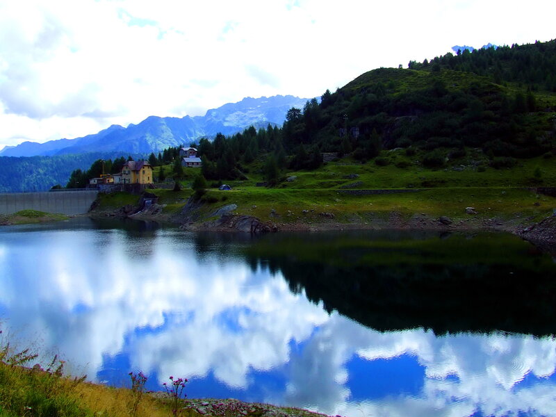 Mountain lake with dam and reflection