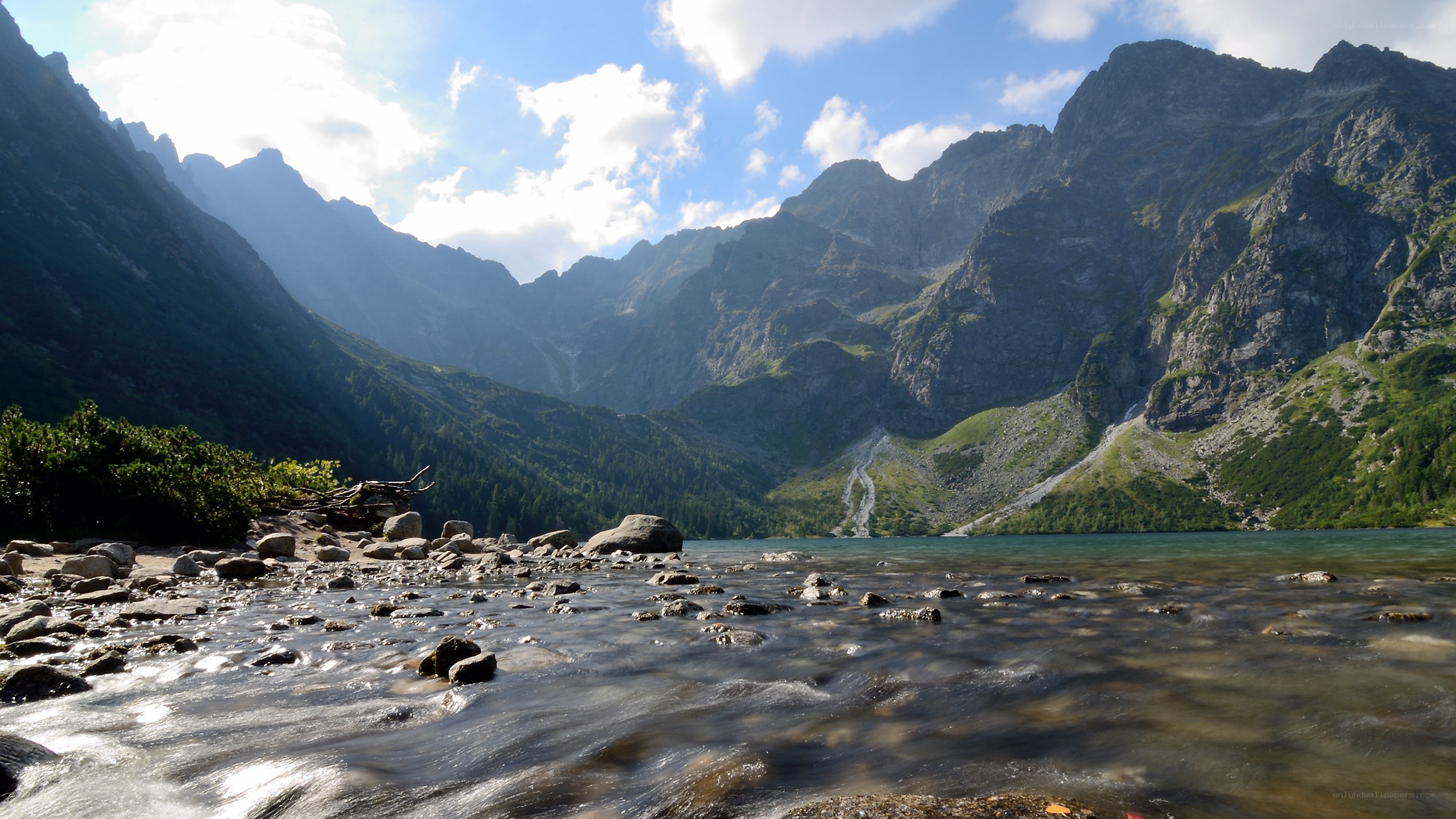 Mountain lake with flowing stream