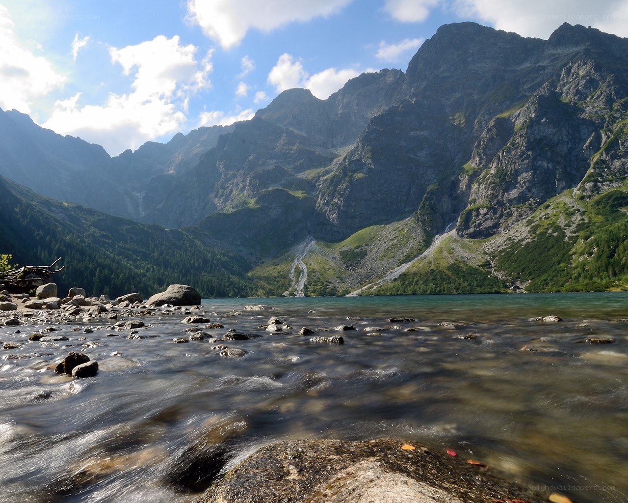 Mountain lake with flowing stream