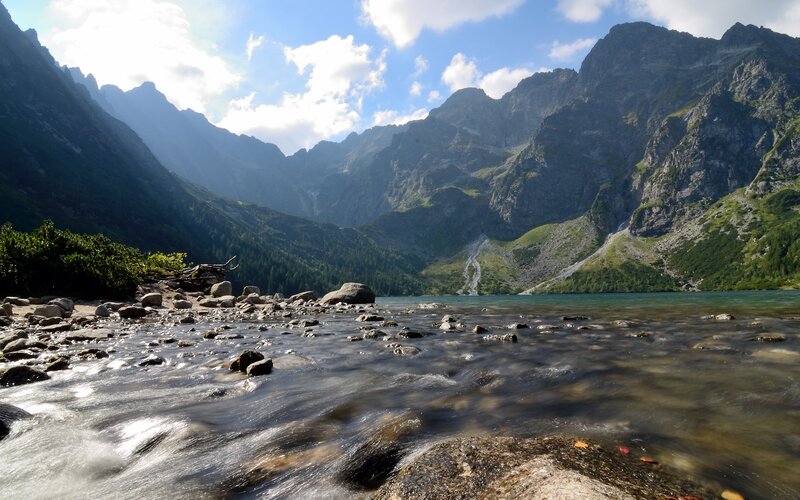 Mountain lake with flowing stream