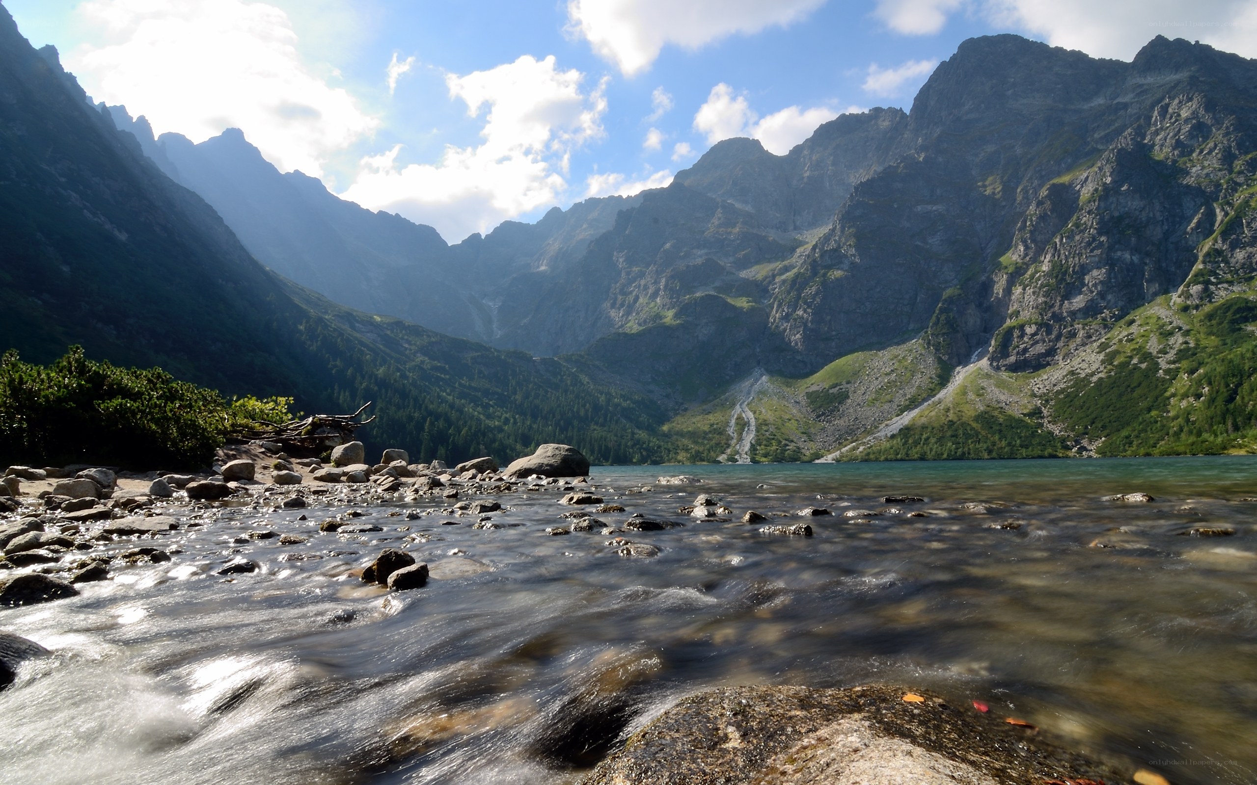 Mountain lake with flowing stream