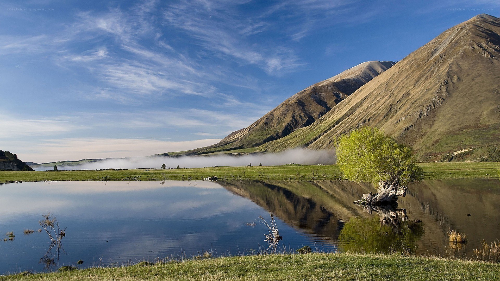 Mountain lake with fog and reflection