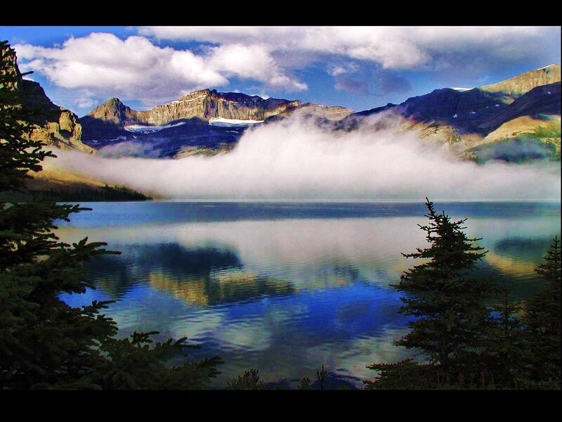 Mountain lake with fog and reflection