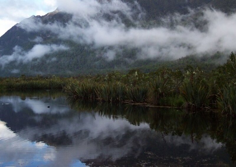 Mountain lake with fog reflection