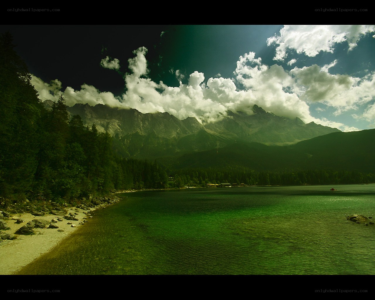 Mountain lake with forest and clouds