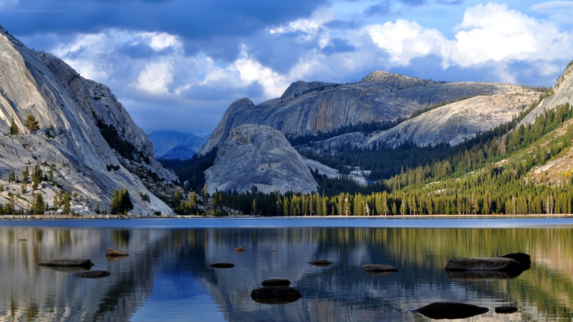 Mountain lake with forest and granite cliffs