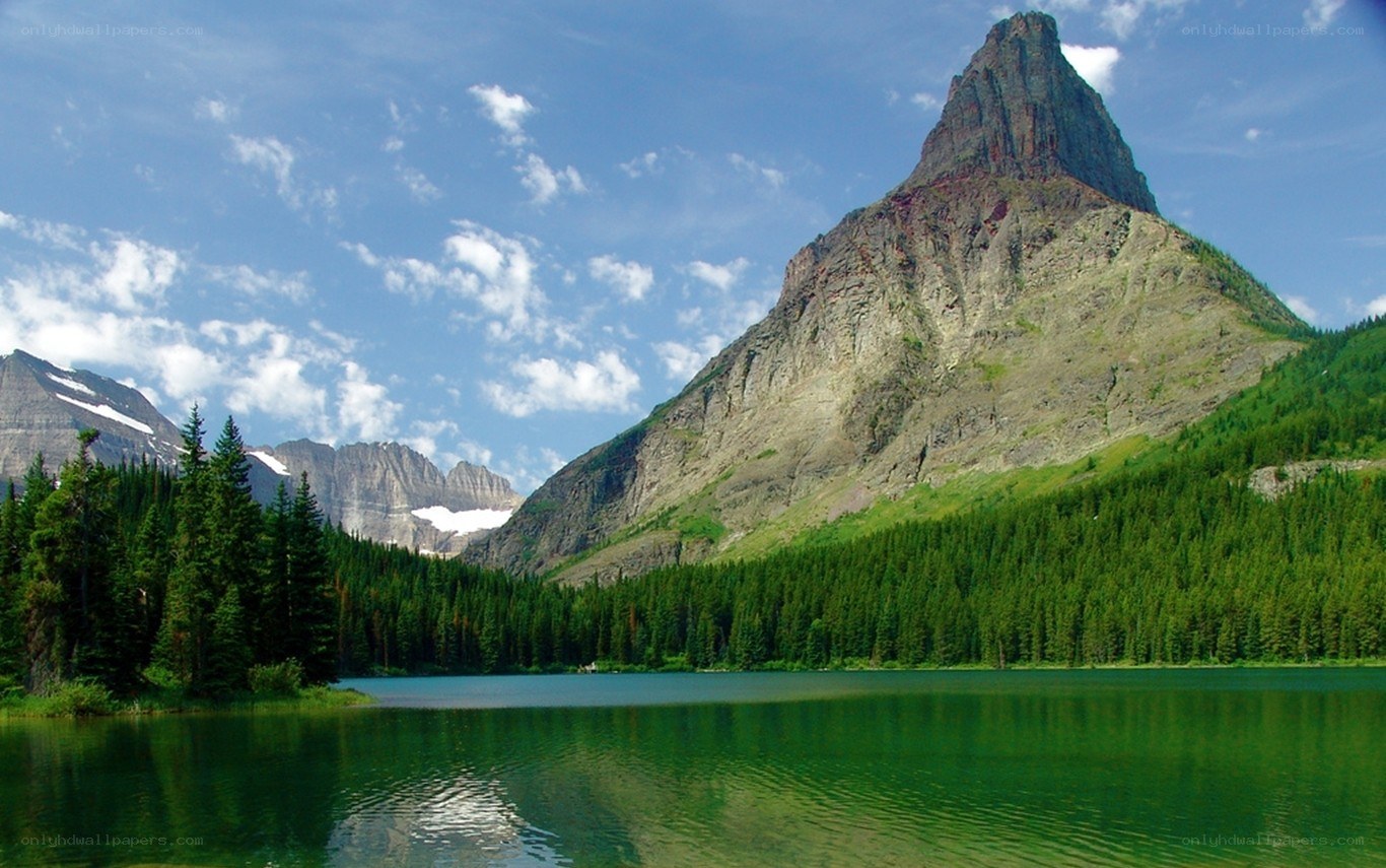 Mountain lake with forest and peak