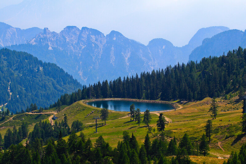 Mountain lake with forest and peaks