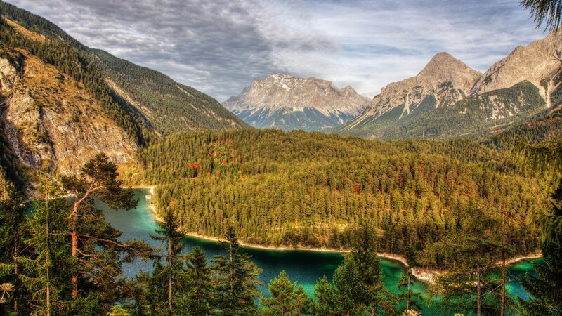 Mountain lake with forest and peaks