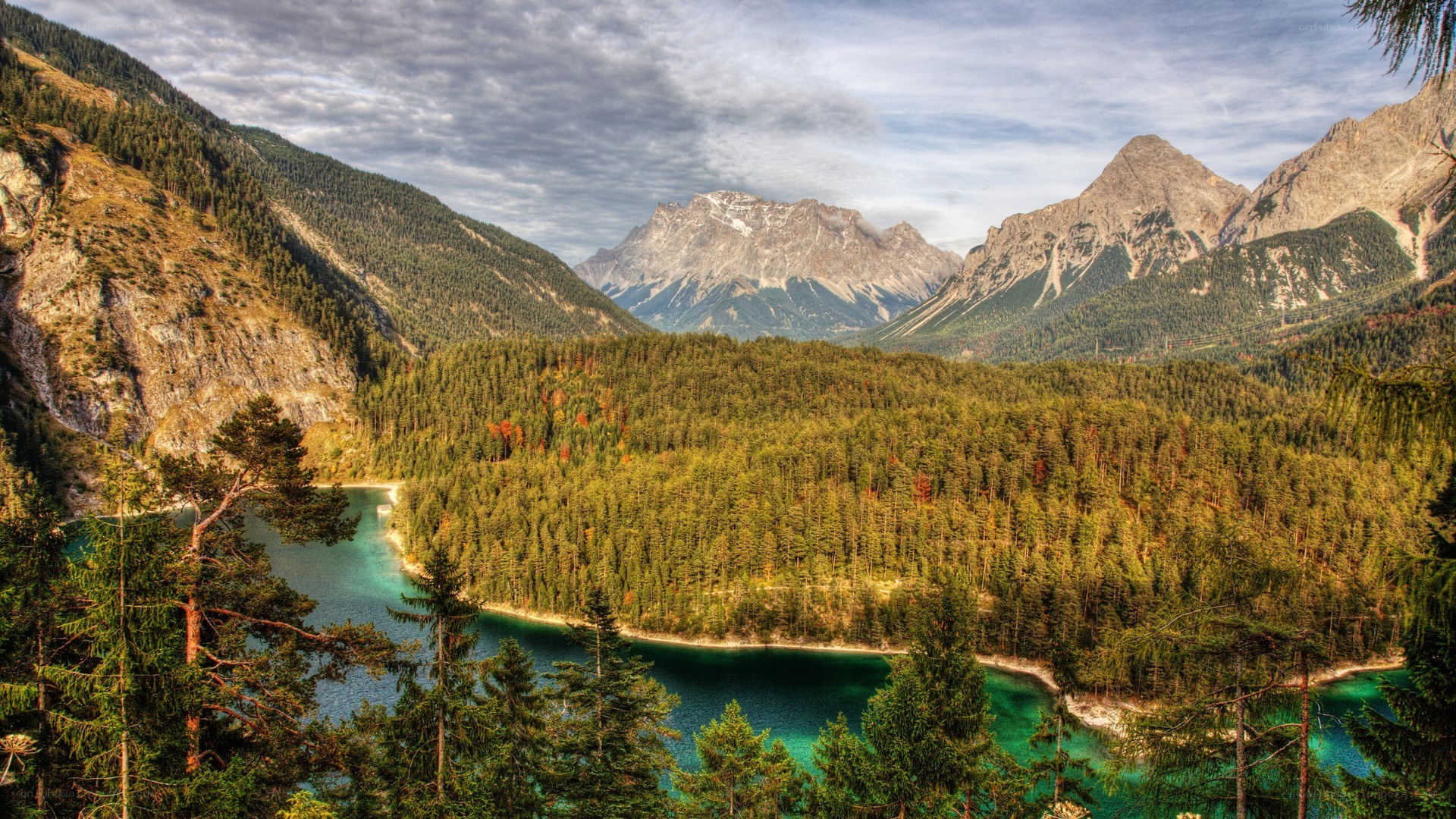 Mountain lake with forest and peaks