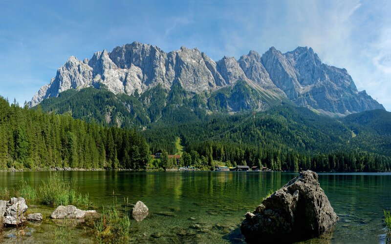 Mountain lake with forest and peaks