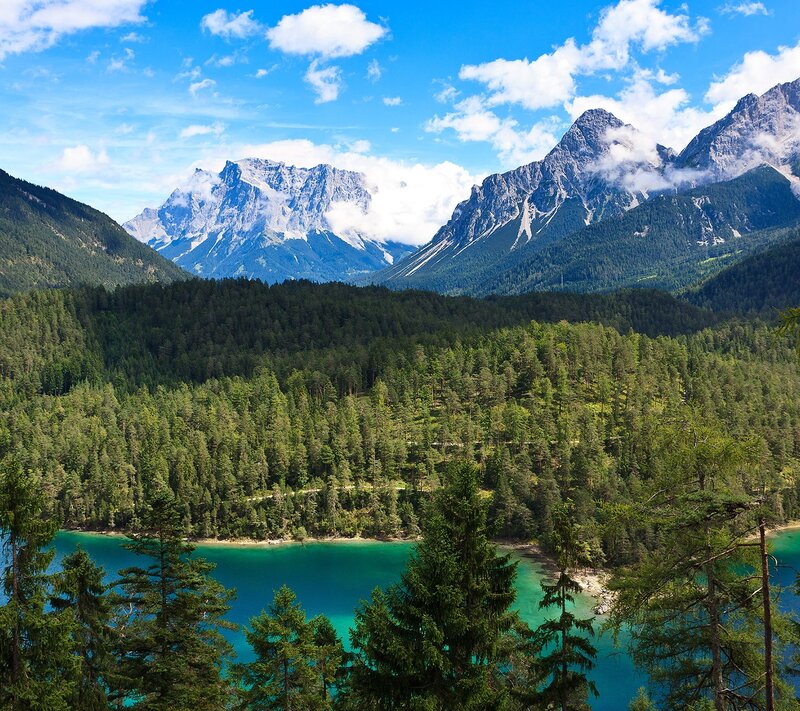 Mountain lake with forest and peaks