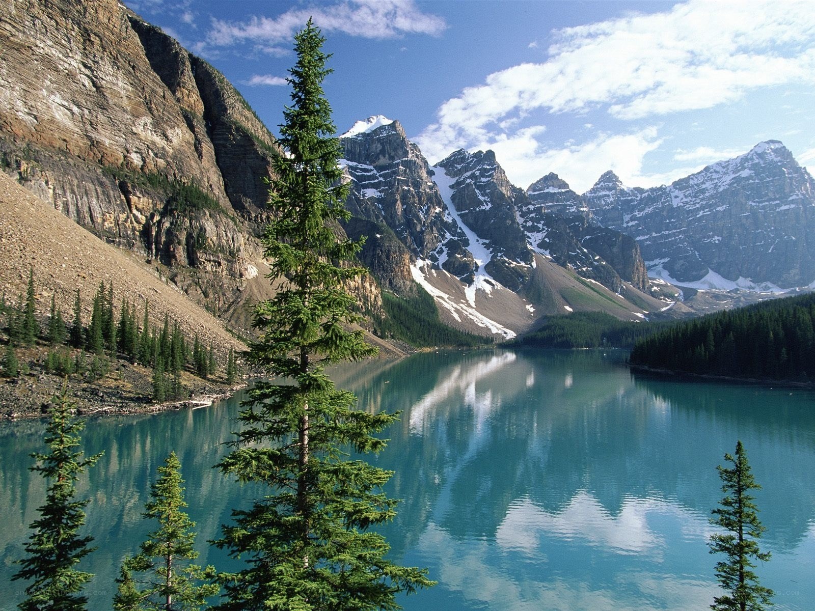 Mountain lake with forest and peaks
