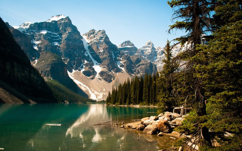 Mountain lake with forest and peaks
