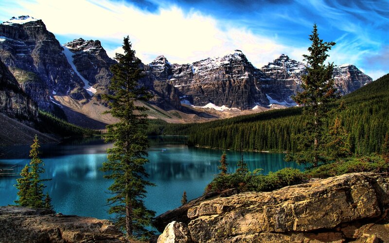 Mountain lake with forest and peaks