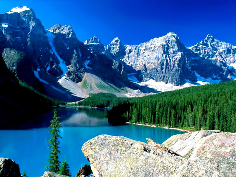 Mountain lake with forest and peaks