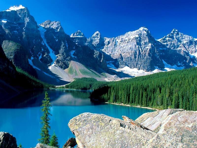Mountain lake with forest and peaks