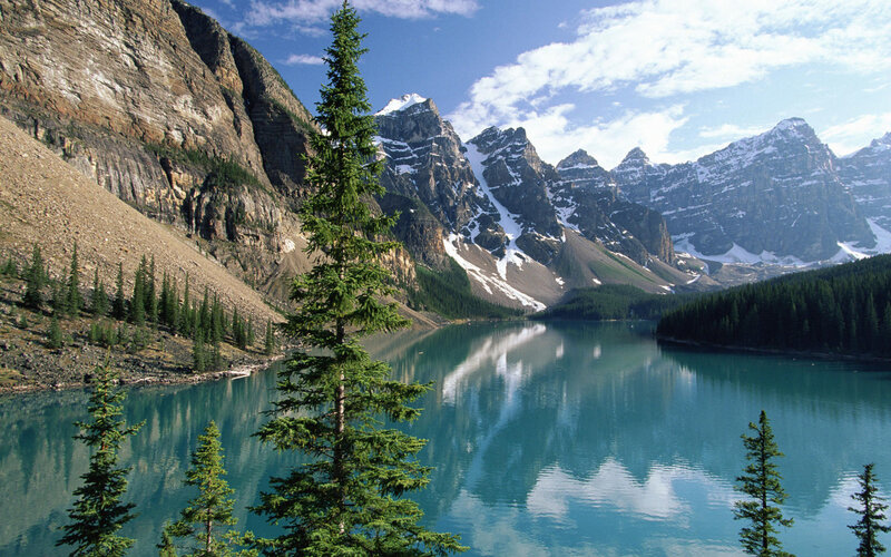 Mountain lake with forest and peaks