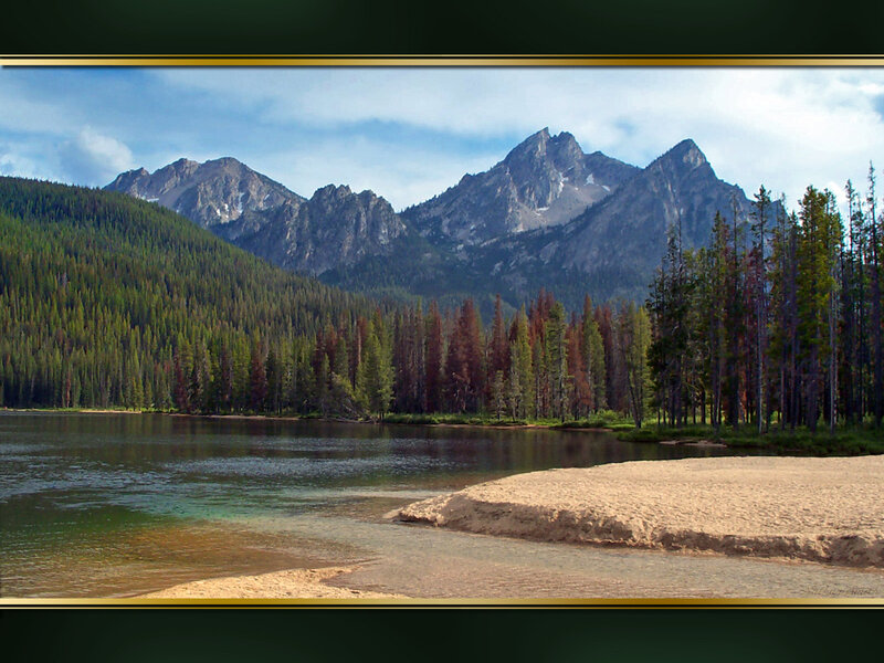 Mountain lake with forest and peaks