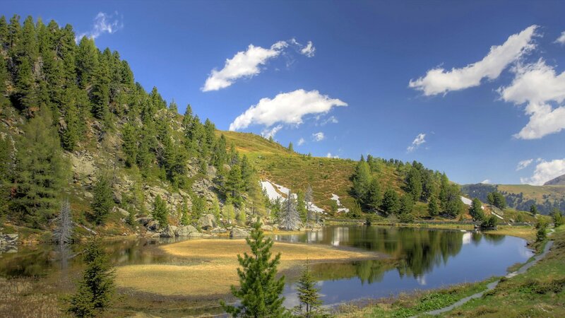 Mountain lake with forest and sky