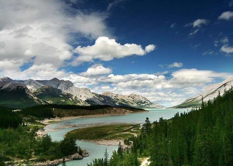 Mountain lake with forest and sky