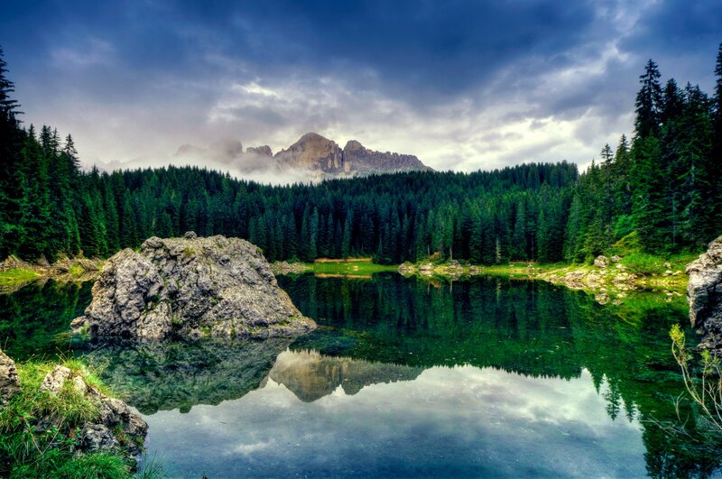 Mountain lake with forest reflection