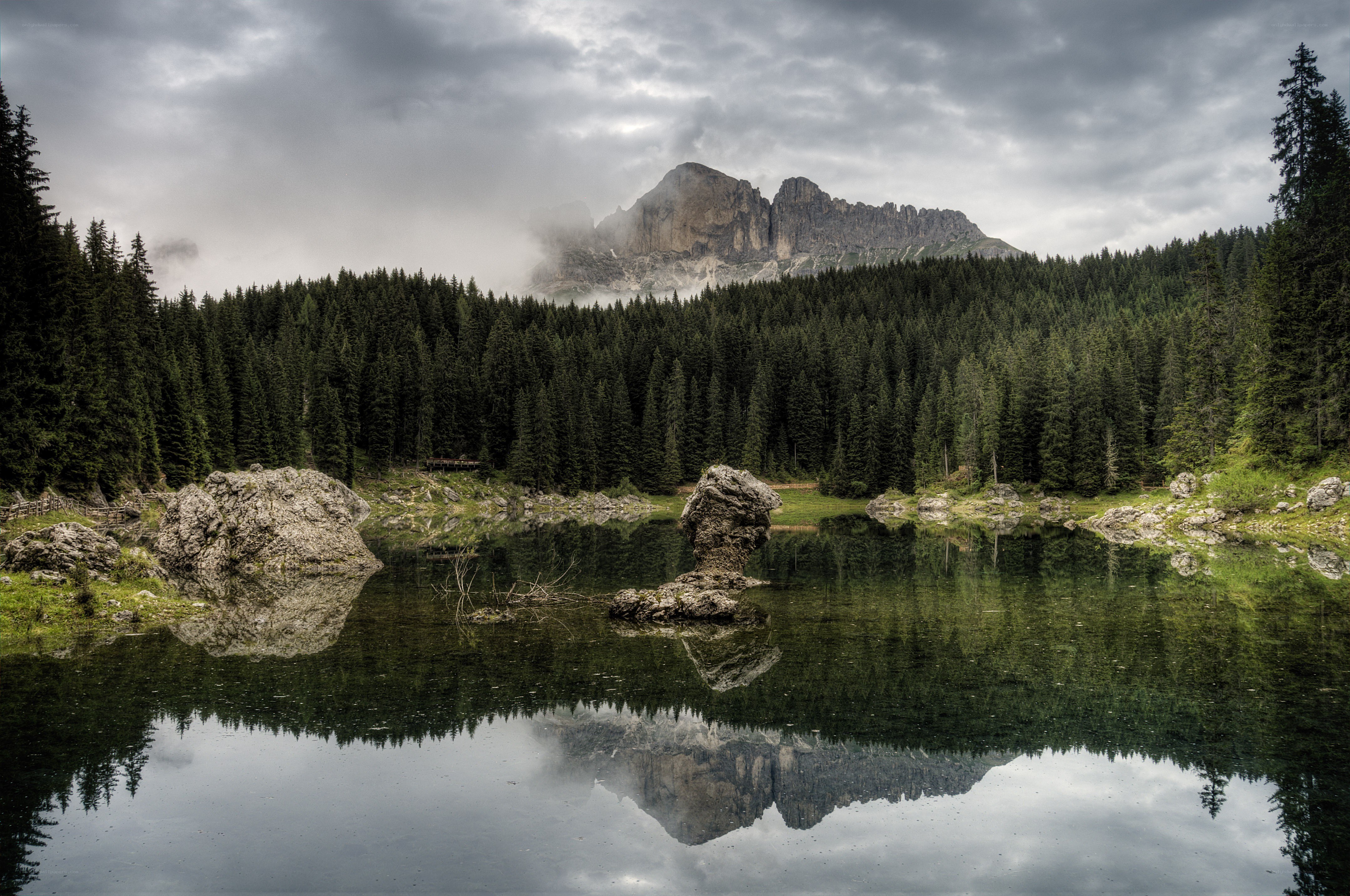 Mountain lake with forest reflection