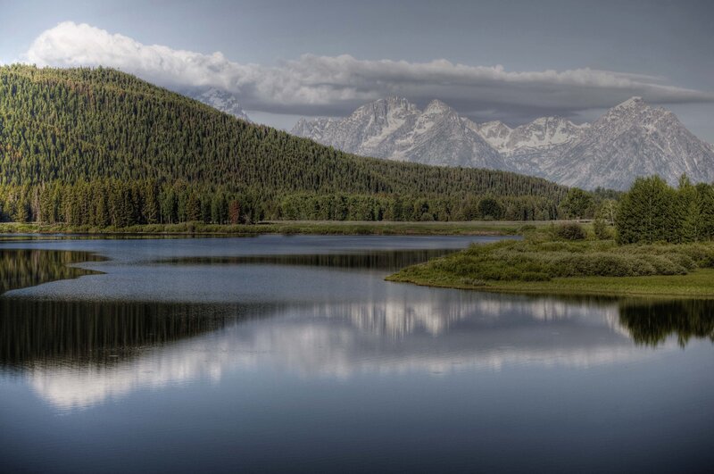 Mountain lake with forest reflection