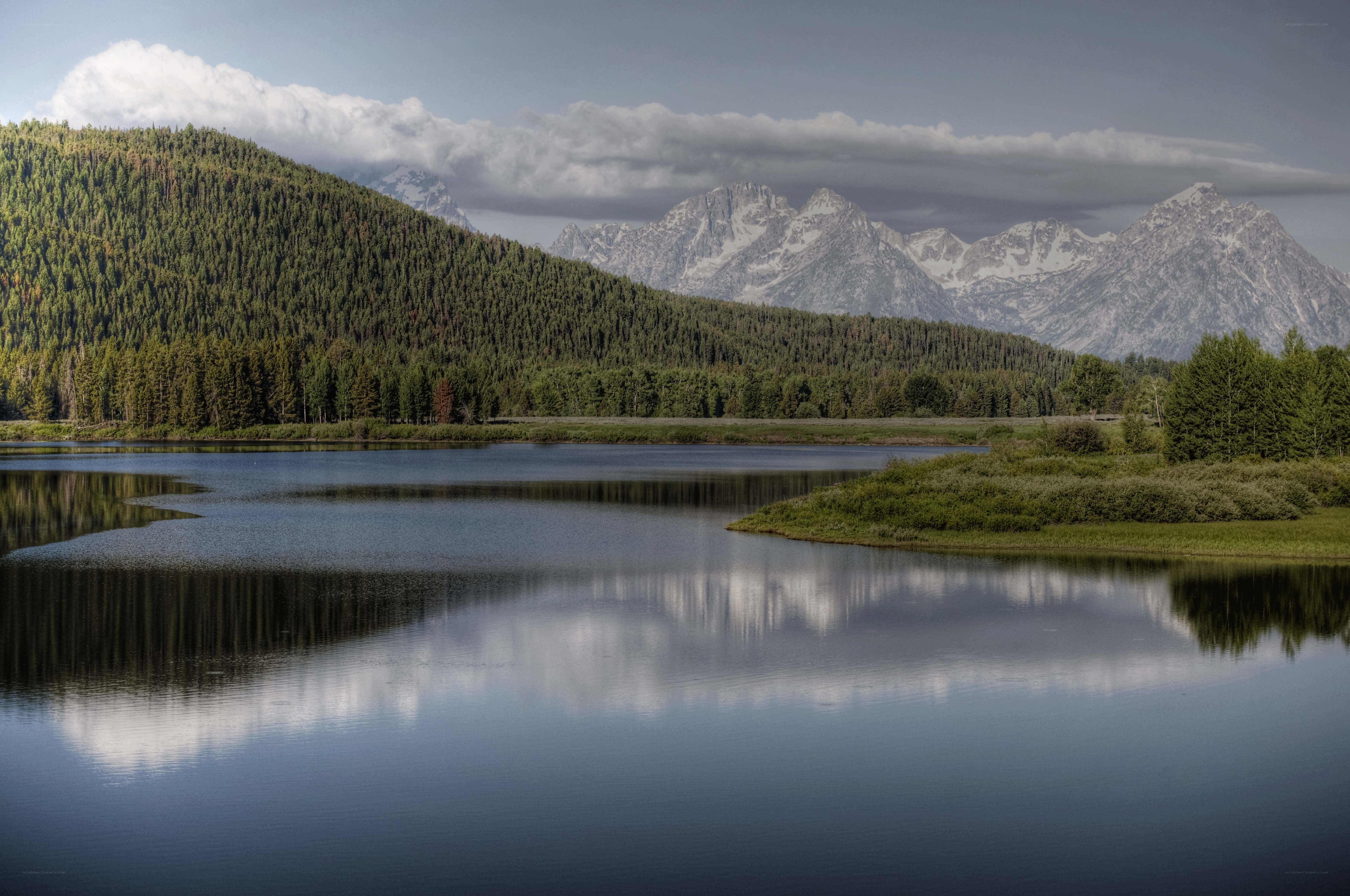Mountain lake with forest reflection