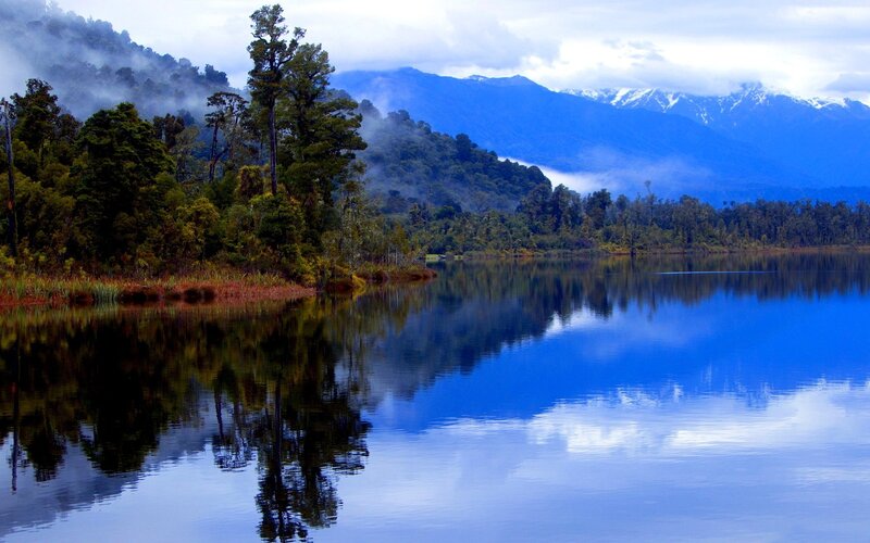Mountain lake with forest reflection